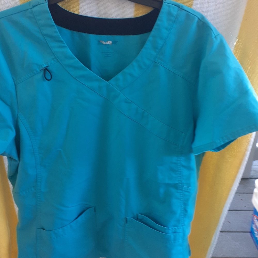 Scrub top teal in color